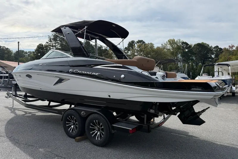 Slide: The Image of 2026 Crownline 298 SS boat interior with luxurious seating and modern dashboard. - 6
