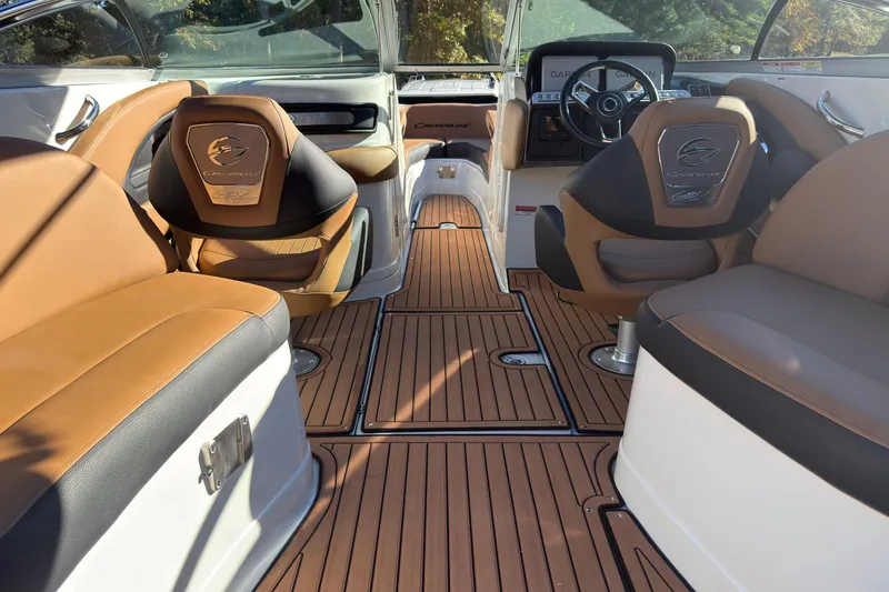 Slide: The Image of Luxurious interior of 2026 Crownline 298 SS boat with elegant seating and wood flooring. - 7