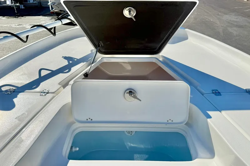 Slide: The Image of 2026 Key West 230 Bay Reef boat with open storage compartment on deck. - 17