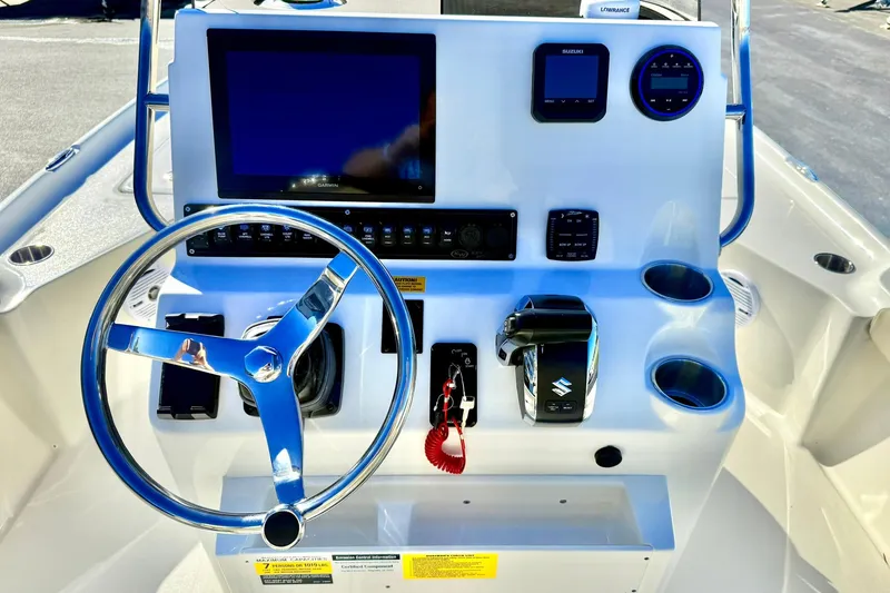 Slide: The Image of Steering console of 2026 Key West 230 Bay Reef boat with modern controls and displays. - 2