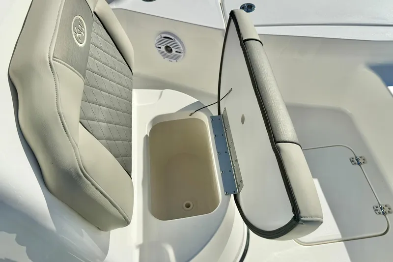 Slide: The Image of 2026 Key West 230 Bay Reef boat seat with storage compartment open. - 26