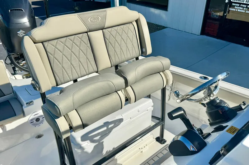 Slide: The Image of 2026 Key West 230 Bay Reef boat interior with dual seats and steering wheel. - 28