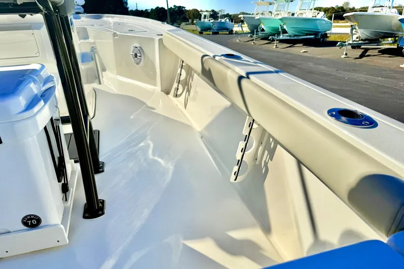 Slide: The Image of 2026 Key West 230 Bay Reef boat interior with rod holders and seating. - 39