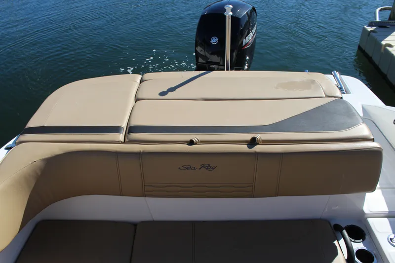 Slide: The Image of 2023 Sea Ray SPX 210 boat with tan seating and Mercury outboard motor. - 20