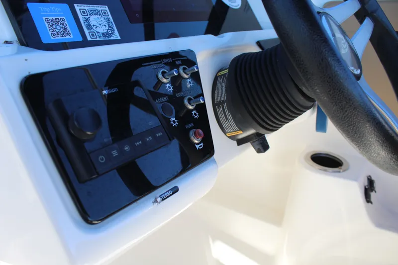 Slide: The Image of 2023 Sea Ray SPX 210 dashboard with steering wheel and control panel. - 22