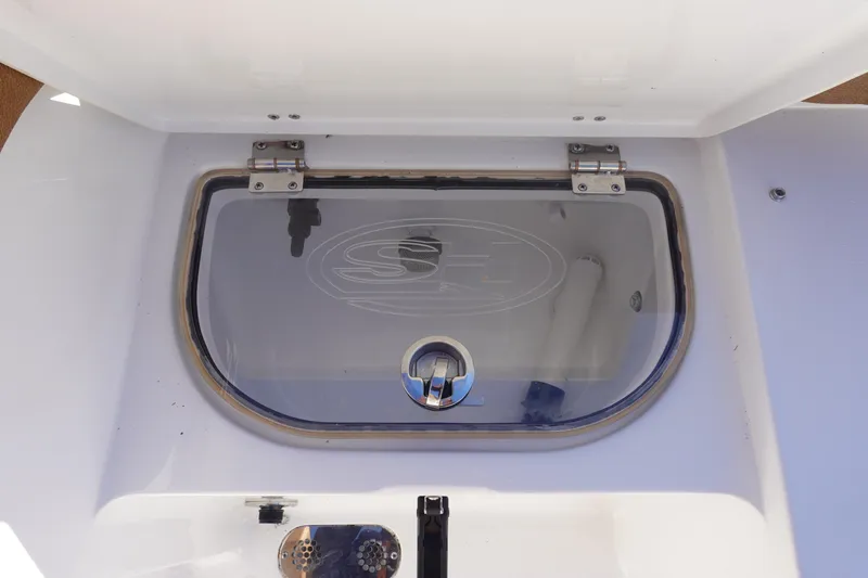 Slide: The Image of 2026 Sea Hunt Ultra 285 Coffin Box boat interior with storage compartments and seating. - 10