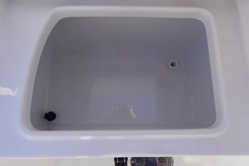 Slide: The Image of 2026 Sea Hunt Ultra 285 Coffin Box, open and empty, showcasing interior space. - 12