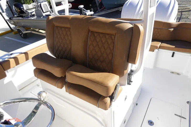 Slide: The Image of 2026 Sea Hunt Ultra 285 Coffin Box interior with sink and cup holders. - 16