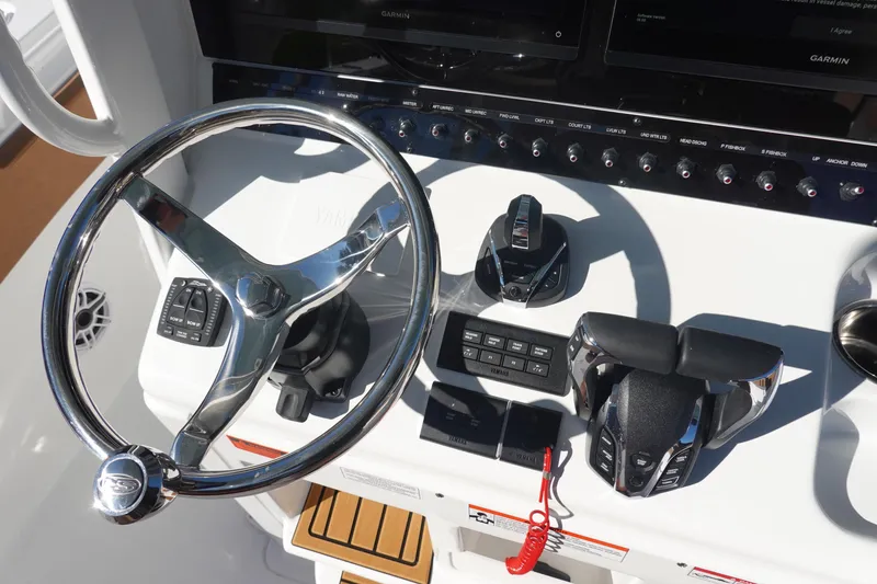 Slide: The Image of Helm of 2026 Sea Hunt Ultra 285 Coffin Box with Garmin displays and controls. - 20