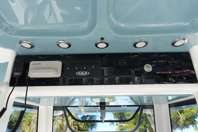 Slide: The Image of 2026 Sea Hunt Ultra 285 Coffin Box boat interior with compass and dashboard view. - 23