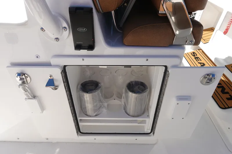 Slide: The Image of 2026 Sea Hunt Ultra 285 Coffin Box boat console with Garmin electronics and overhead lighting. - 24