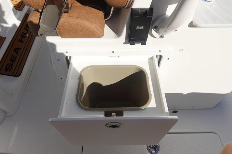 Slide: The Image of 2026 Sea Hunt Ultra 285 Coffin Box interior storage compartment with seating. - 25