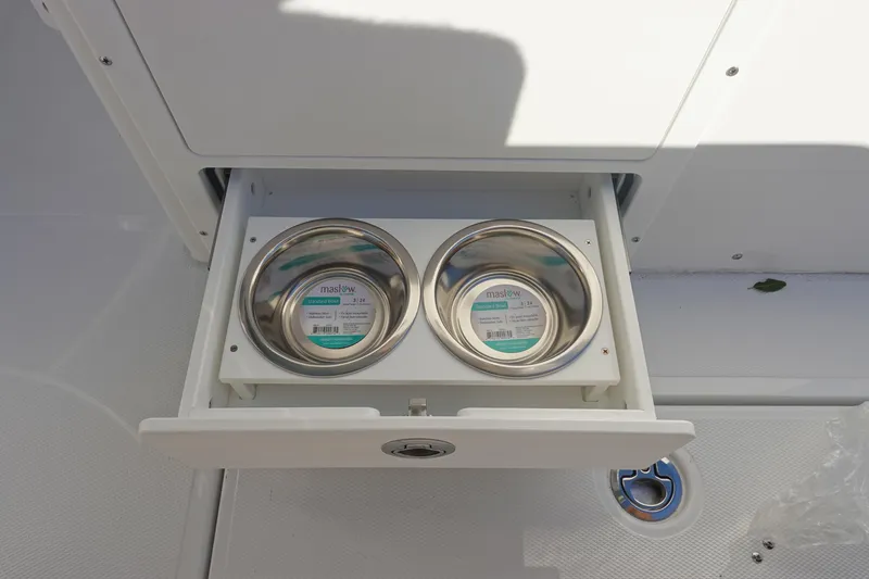 Slide: The Image of 2026 Sea Hunt Ultra 285 Coffin Box with open storage compartment. - 26