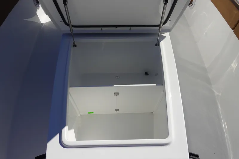 Slide: The Image of 2026 Sea Hunt Ultra 285 Coffin Box with brown cushioned seating and cup holders. - 31