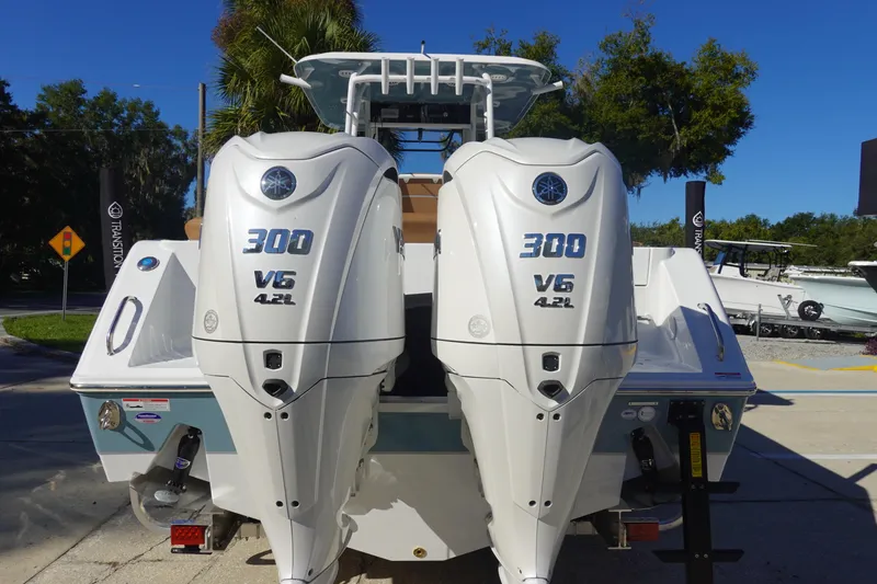 Slide: The Image of 2026 Sea Hunt Ultra 285 Coffin Box boat on trailer, displayed outdoors. - 4