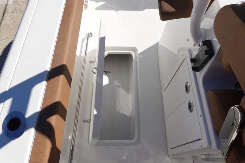 Slide: The Image of 2026 Sea Hunt Ultra 285 Coffin Box interior with open storage compartment. - 43
