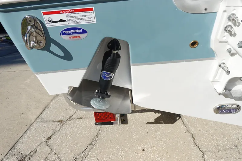 Slide: The Image of 2026 Sea Hunt Ultra 285 Coffin Box with twin 300 V6 engines, docked outdoors. - 5