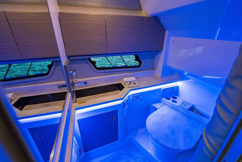 Slide: The Image of 2019 Formula 430 All Sport Crossover interior with blue ambient lighting and modern design. - 44