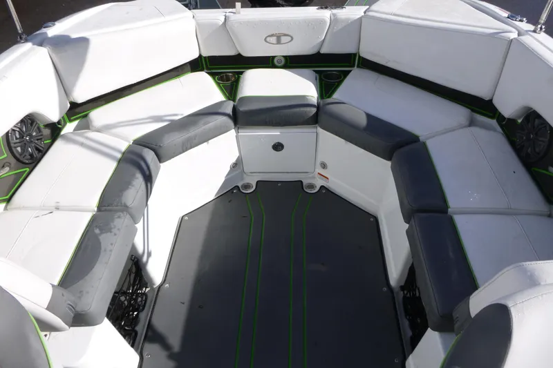 Slide: The Image of 2021 Tahoe 210 S boat interior with cushioned seating and modern design. - 11