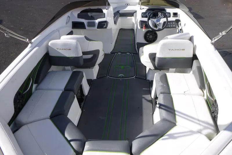 Slide: The Image of Interior of a 2021 Tahoe 210 S boat with seating and steering wheel. - 5