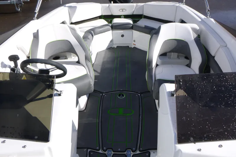 Slide: The Image of 2021 Tahoe 210 S boat interior with white seating and green accents. - 6