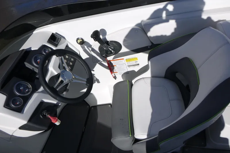 Slide: The Image of Cockpit of 2021 Tahoe 210 S boat with steering wheel and control panel. - 8