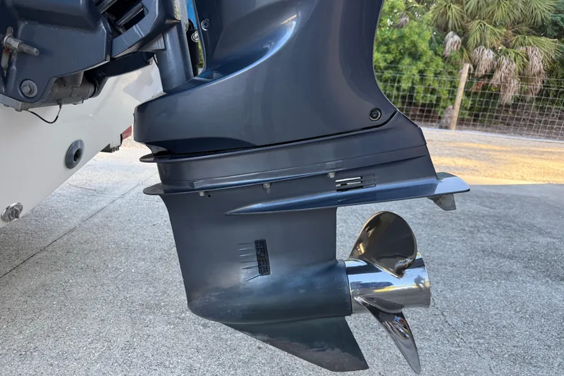 Slide: The Image of Close-up of a 2017 NauticStar 2302 Legacy boat motor and propeller. - 14