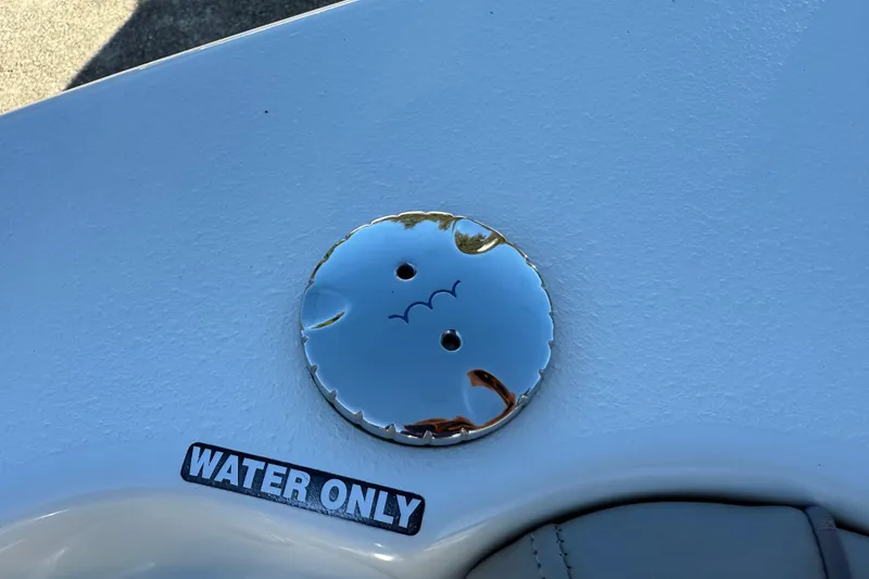 Slide: The Image of Chrome water cap on 2017 NauticStar 2302 Legacy boat, labeled "Water Only." - 21