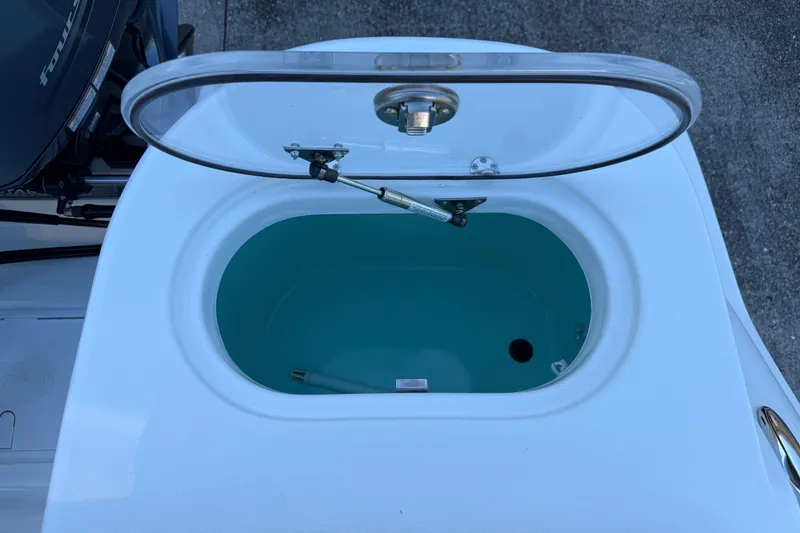 Slide: The Image of Open livewell on 2017 NauticStar 2302 Legacy boat, showcasing interior details. - 22