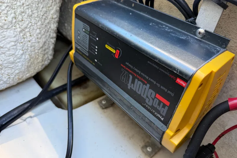 Slide: The Image of Battery charger in a 2017 NauticStar 2302 Legacy boat, featuring ProSport 12 model. - 24