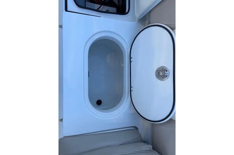 Slide: The Image of Open storage compartment on 2017 NauticStar 2302 Legacy boat. - 25