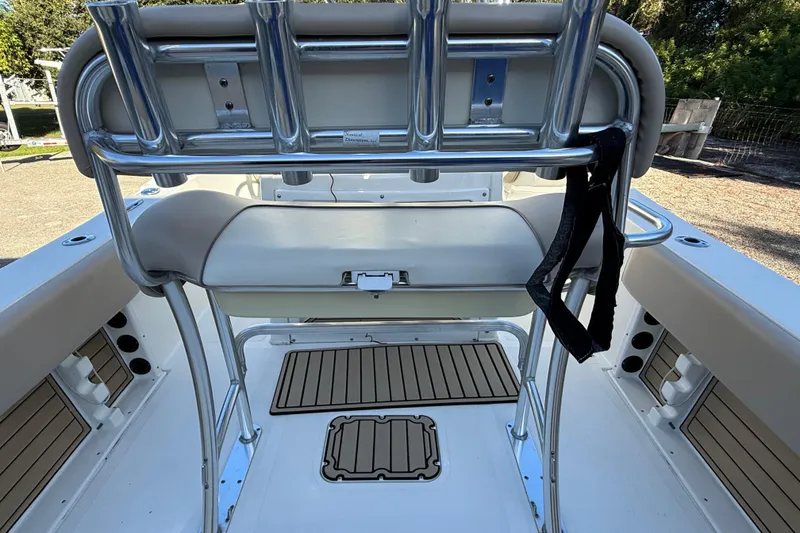 Slide: The Image of 2017 NauticStar 2302 Legacy boat interior with seating and rod holders. - 31