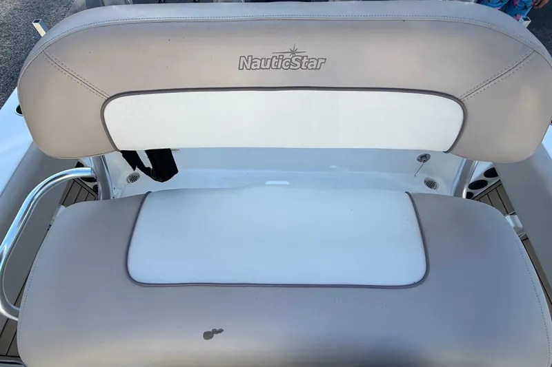 Slide: The Image of NauticStar 2302 Legacy 2017 boat seat with beige and white upholstery. - 33