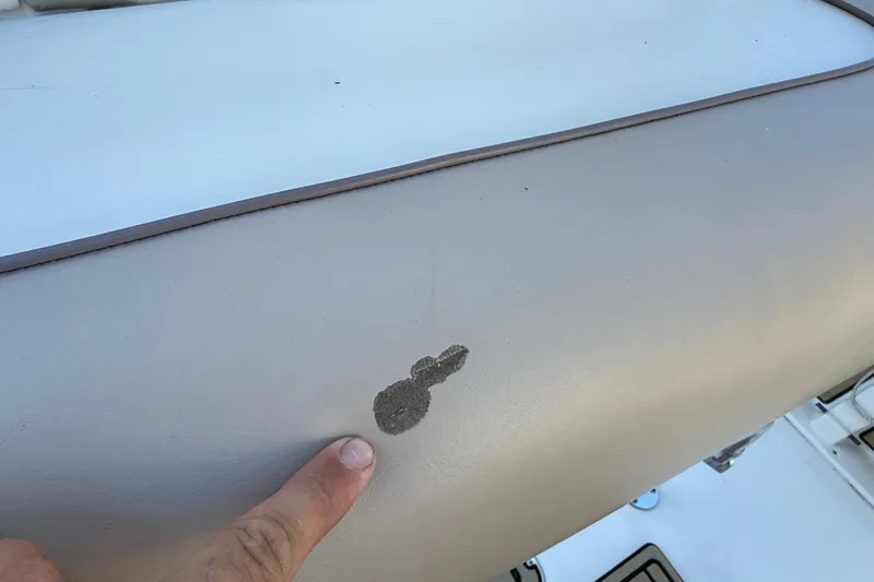 Slide: The Image of Close-up of a 2017 NauticStar 2302 Legacy boat seat with a small stain. - 34