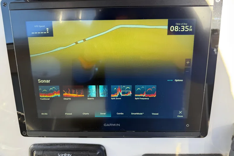 Slide: The Image of Garmin sonar display on 2017 NauticStar 2302 Legacy boat, showing navigation and sonar options. - 38