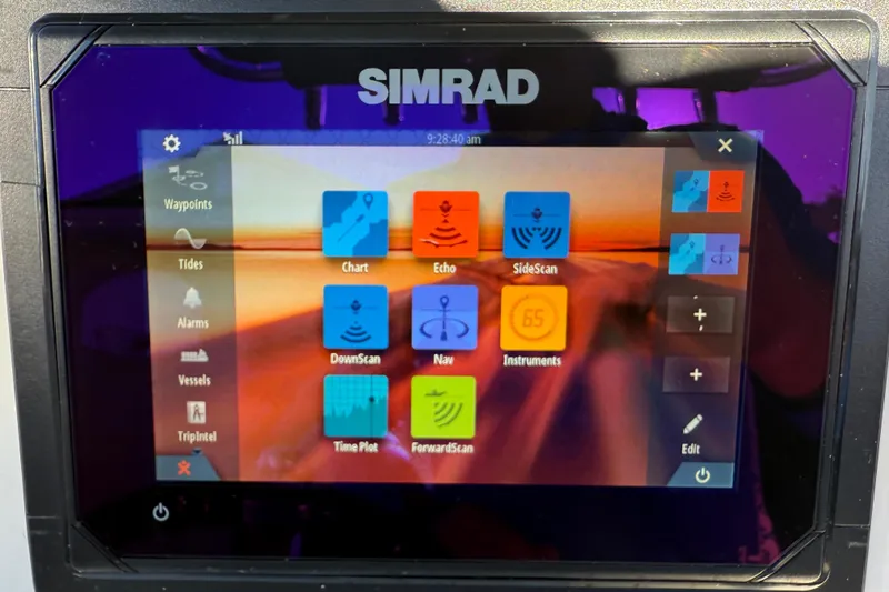 Slide: The Image of Simrad marine display on 2017 NauticStar 2302 Legacy boat, showing navigation and sonar options. - 39