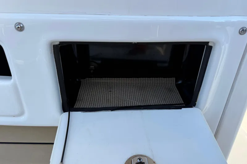 Slide: The Image of Storage compartment on a 2017 NauticStar 2302 Legacy boat. - 44