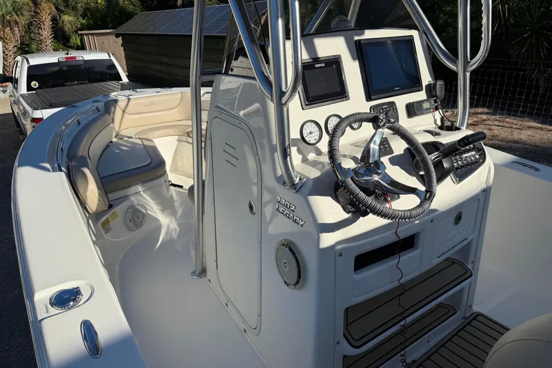 Slide: The Image of 2017 NauticStar 2302 Legacy boat interior with steering console and seating area. - 45