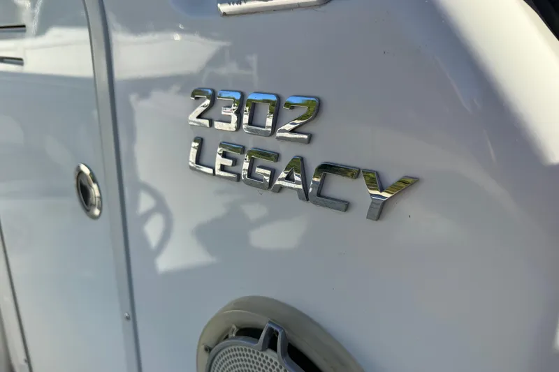 Slide: The Image of 2017 NauticStar 2302 Legacy boat emblem on white surface. - 47