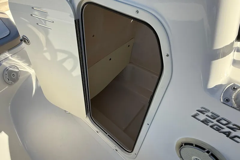 Slide: The Image of Open storage compartment on 2017 NauticStar 2302 Legacy boat. - 48