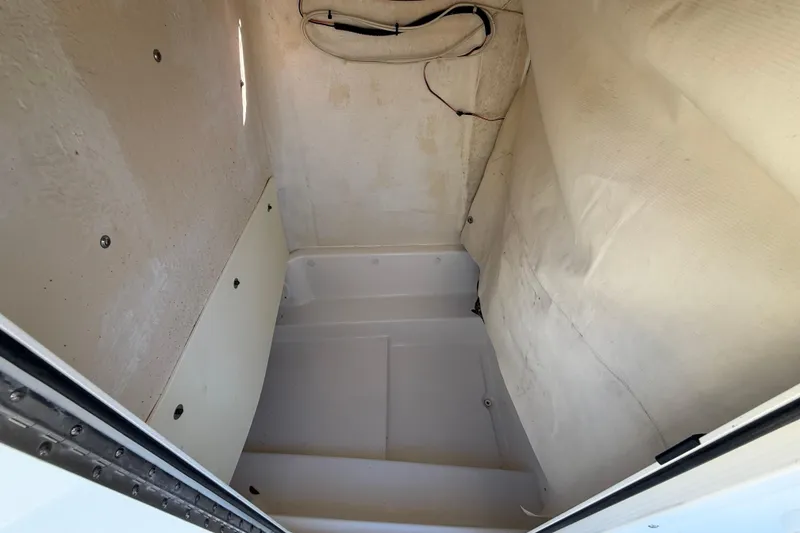 Slide: The Image of Interior cabin of 2017 NauticStar 2302 Legacy boat, showing storage space. - 49