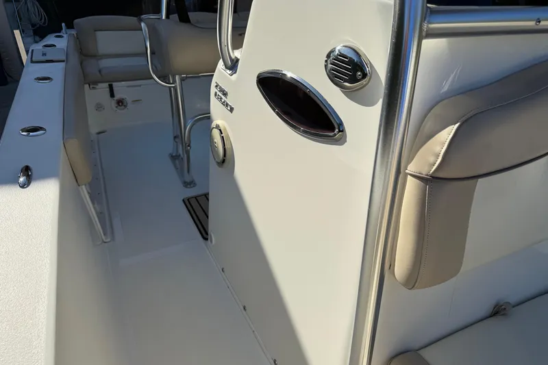 Slide: The Image of 2017 NauticStar 2302 Legacy boat interior with seating and stainless steel details. - 54