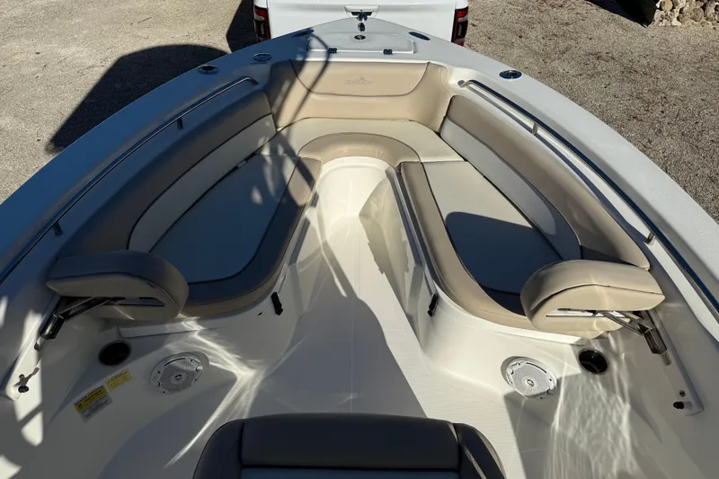 Slide: The Image of 2017 NauticStar 2302 Legacy boat interior with cushioned seating and storage compartments. - 56