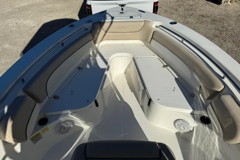 Slide: The Image of 2017 NauticStar 2302 Legacy boat interior with cushioned seating and storage compartments. - 57
