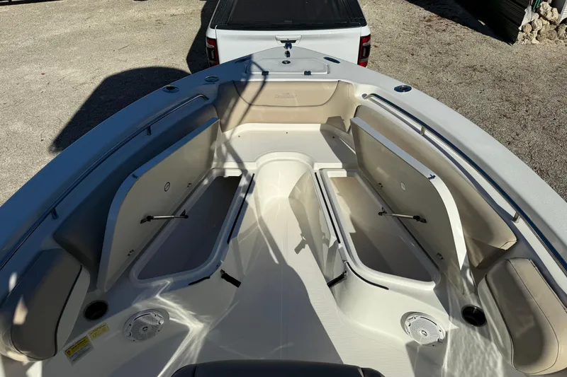 Slide: The Image of 2017 NauticStar 2302 Legacy boat interior with open storage compartments. - 58