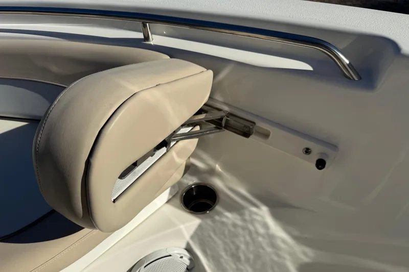 Slide: The Image of 2017 NauticStar 2302 Legacy boat seat detail with beige upholstery and stainless steel rail. - 61