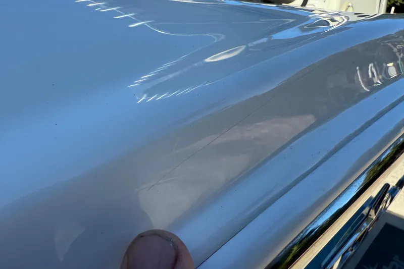 Slide: The Image of Close-up of 2017 NauticStar 2302 Legacy boat surface with visible scratch. - 64