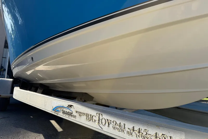 Slide: The Image of 2017 NauticStar 2302 Legacy boat on trailer, close-up view of hull. - 7