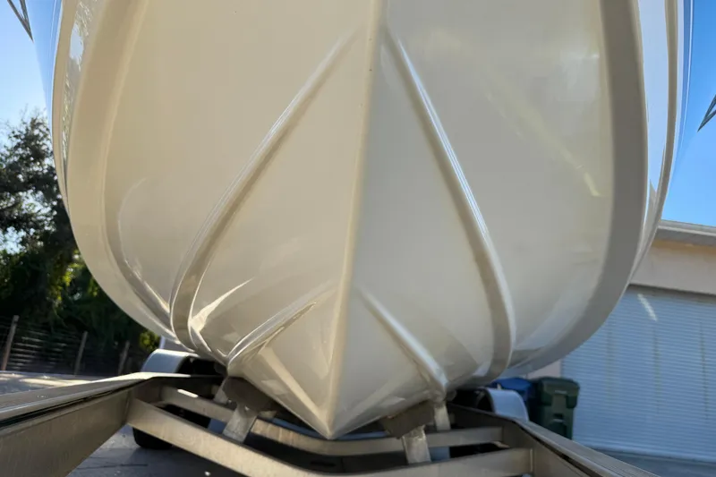 Slide: The Image of Close-up of 2017 NauticStar 2302 Legacy boat hull on trailer, outdoors. - 8