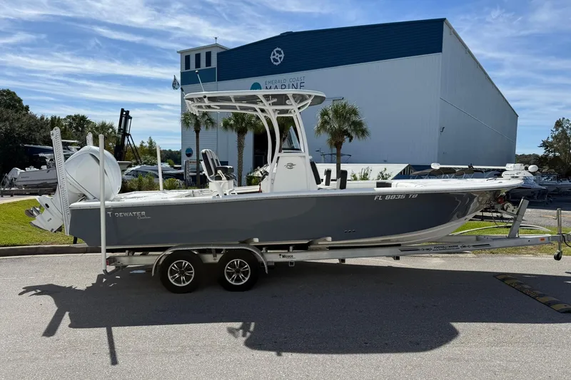 Slide: The Image of 2021 Tidewater 2500 Carolina Bay boat on trailer outside marine facility. - 1